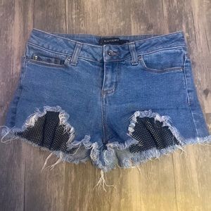 Size 1 high waisted blue jean shorts with nets. never worn. no rips, stains.